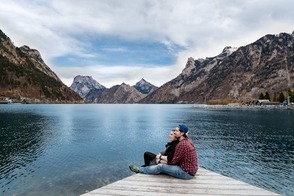 couple sitting by a lake