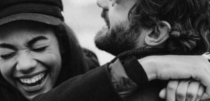 Couple laughing and hugging
