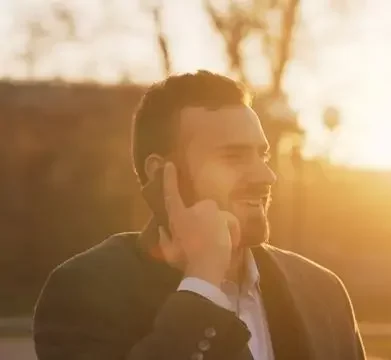 man on phone checking in