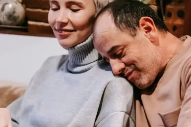 couple cuddling on couch